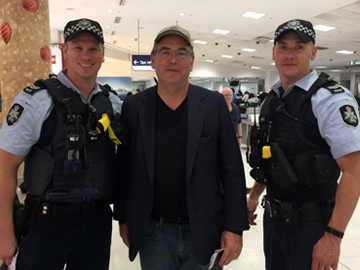 Man with two police officers