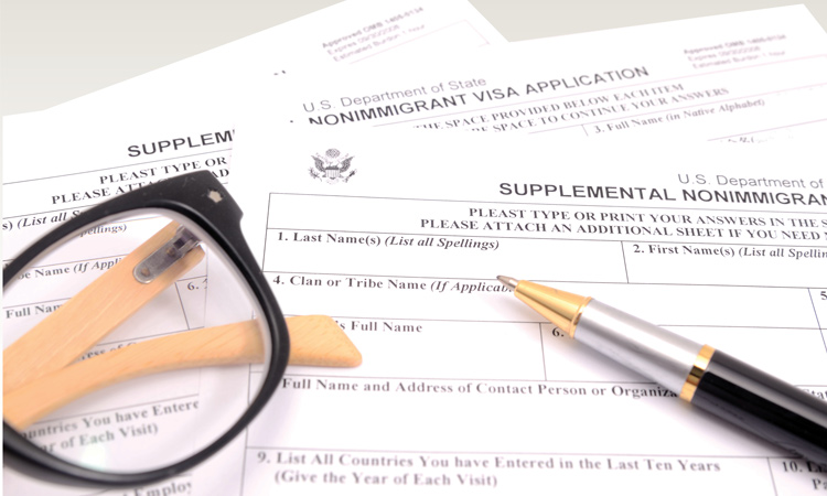 Pen and glasses on government forms