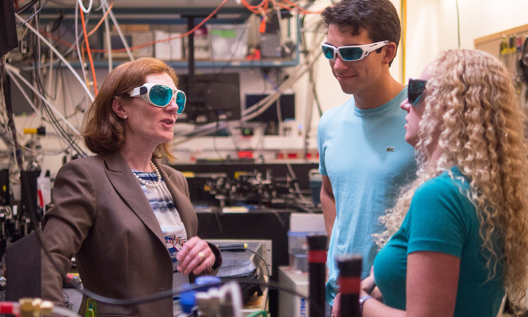 Three people in a lab