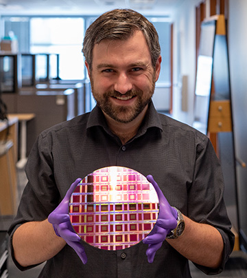 Photo of man with Lumotive wafer