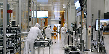 Workers in manufacturing facility
