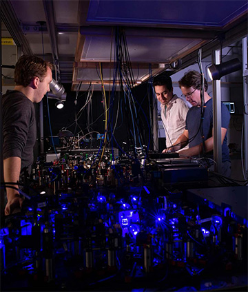 photo of scientists in laser lab