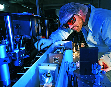 man in lab with laser