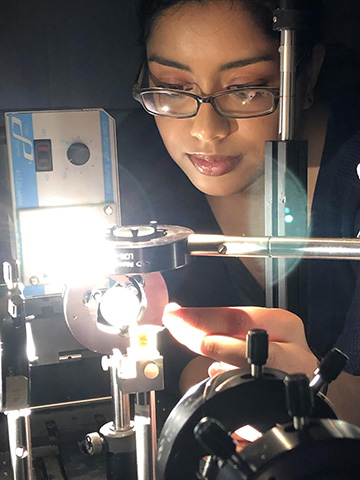 photo of woman in lab with light