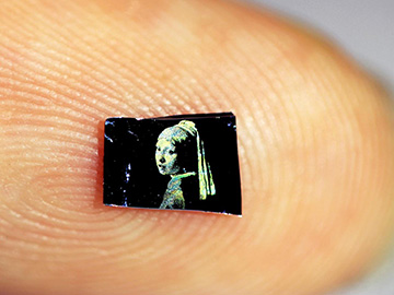 printed Vermeer microimage on fingertip