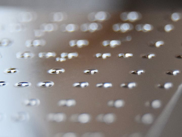 Wafer with line of small conical lenses