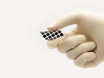 hand flexing thin-film solar cells