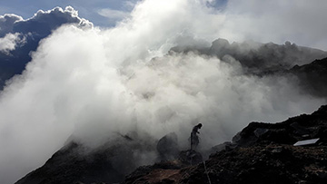 photo of researcher at fumarole site