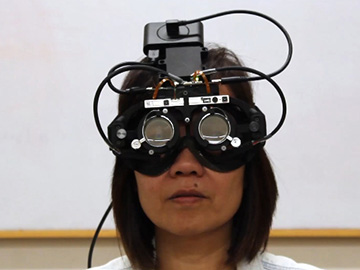 User wearing Autofocals headset