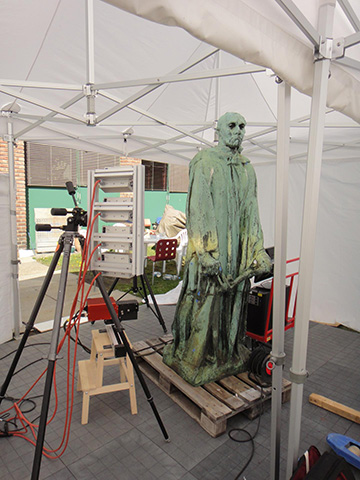green statue with hyperspectral camera under tent