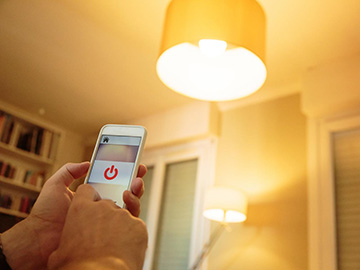 photo of smartphone and lamp