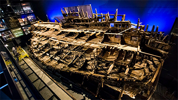 Photo of salvaged vessel in museum setting