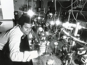 Photo of Anthony Johnson in his lab at AT&T Bell Labs in 1986