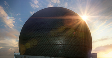 A photo of the Sphere taken at sunrise.